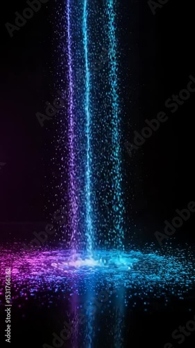 Colorful water droplets cascading onto dark surface