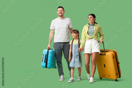Family of tourists with sui...