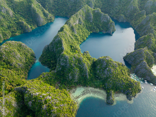 Tropical Lakes surrounded by splendid limestone rocks. Kayangan Lake. Barracuda Lake. Coron, Palawan. Philippines.