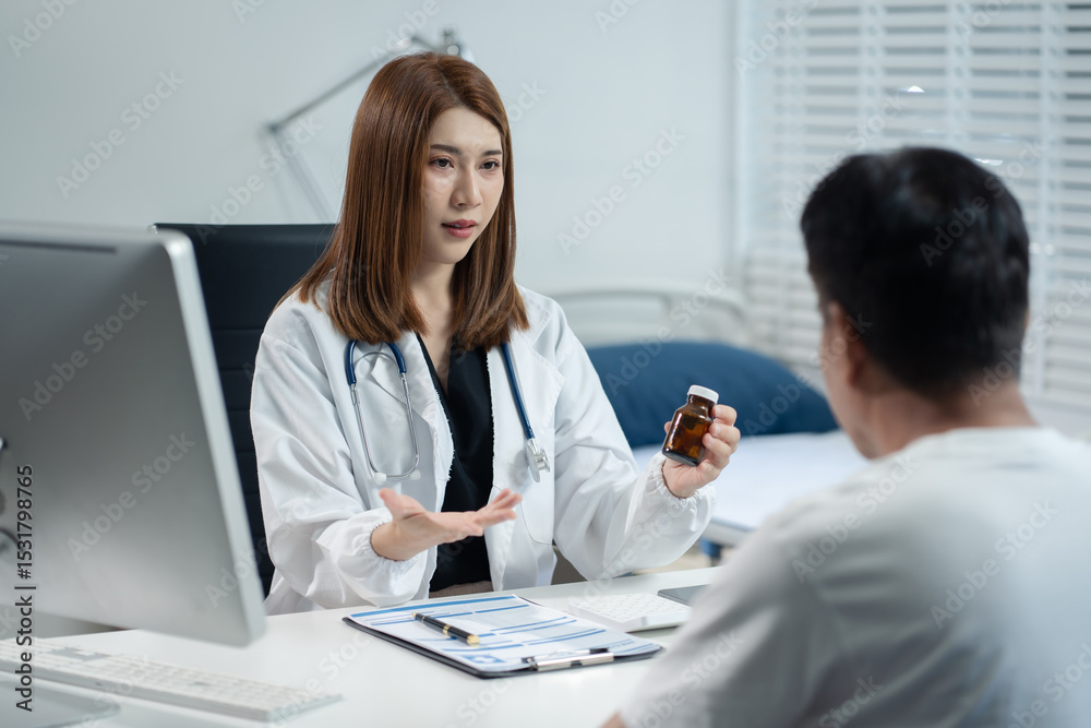Fototapeta premium Female doctor gives medication advice to an elderly patient.