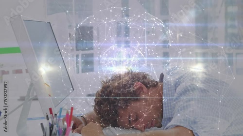Office worker pressing temples at desk causing pulsing globe above head slumping from overload