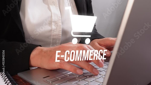 Close-up of hands typing on a laptop with a shopping cart icon and the text 