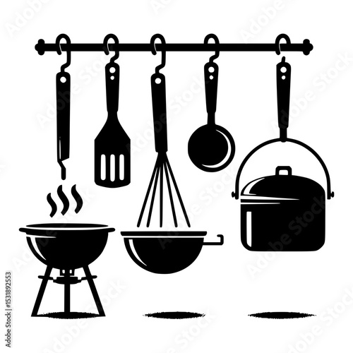 Kitchen utensils hanging on rack with grill