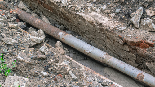 Replacement of old water pipes located underground. Repair of underground utilities. It is necessary to replace the old rusty water pipes. Excavation work during the reconstruction of communications.