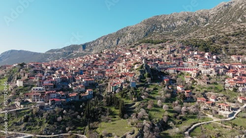 Aerial view of Arachova mountain town uphill houses, Boeotia, Drone shot, Establishing