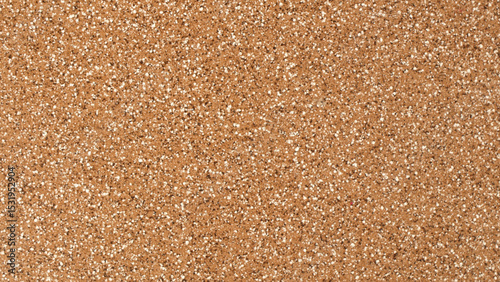 Detailed close up view of a brown corkboard texture with a natural random pattern