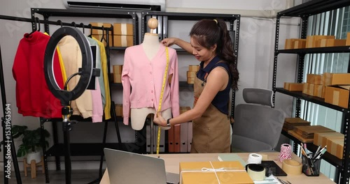 a woman is live streaming to introduce her produce her products to interested customers and also pack the products for customers who have already ordered, parcel, clothing, sale, startup