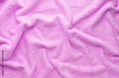 Crumpled purple fleecy fabric closeup texture