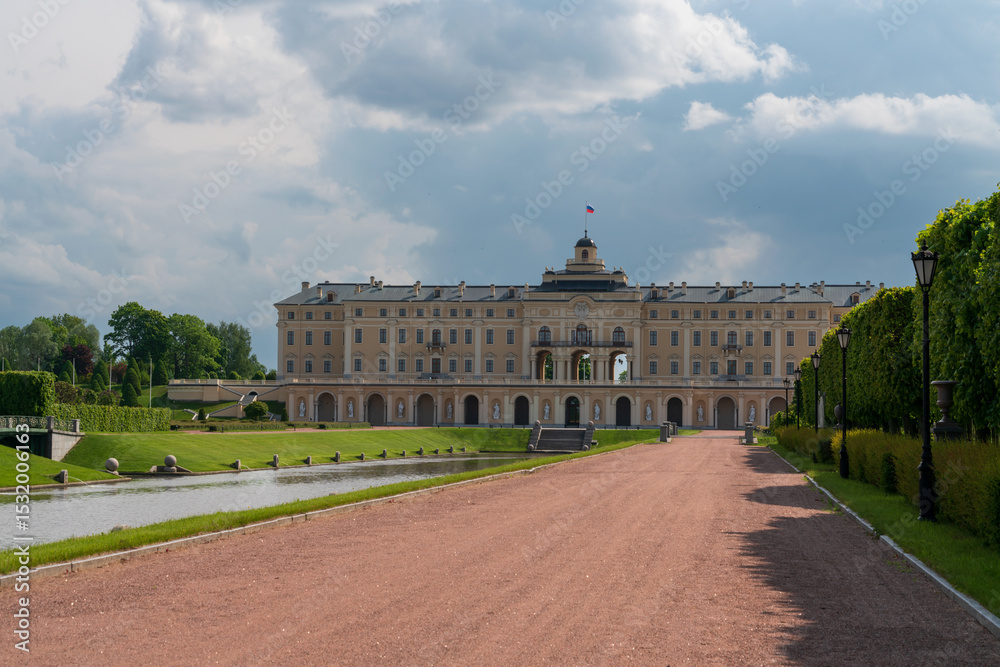 Fototapeta premium Constantine Palace (Bolshoy Strelninsky Palace) of the palace and park ensemble in Strelna from the side of Nizhny Park on a sunny summer day, Strelna, St. Petersburg, Russia