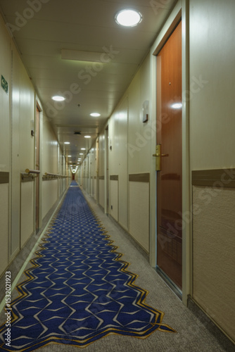 Opulent Art Deco interior architecture inside lobby, atrium or foyer on modern ocean liner style cruiseship cruise ship with staircase, corridors, carpets, chandeliers and art work