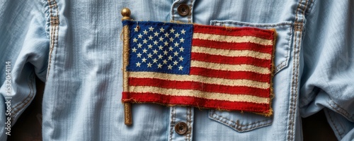 Wearing american pride flag patch on denim shirt casual setting close-up shot symbol of patriotism