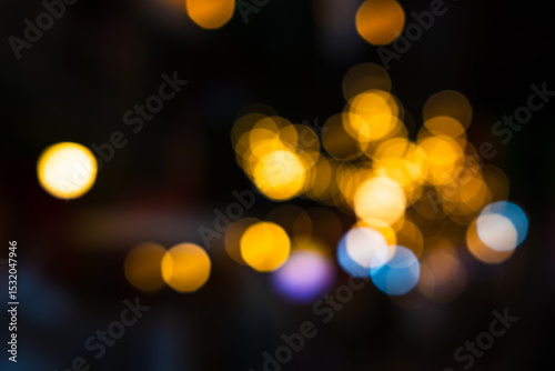 Golden bokeh background from sparkling lanterns for celebration.