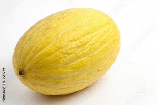 Single pale yellow melon on white background
