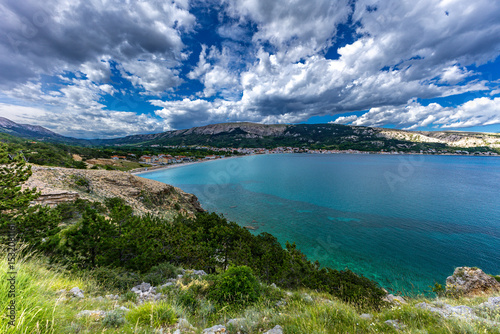 Fototapeta Naklejka Na Ścianę i Meble -  Hiking trail leading from the beach in Baska to the Bag mountain, city panorama seen from above,