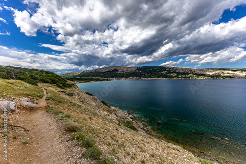 Fototapeta Naklejka Na Ścianę i Meble -  A walk along the rocky road from the beach in Baska to the top of Mount Bag,