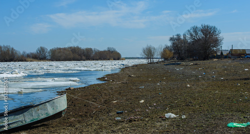 Large chunks of ice float down the Bakhthiyar River during spring thaw