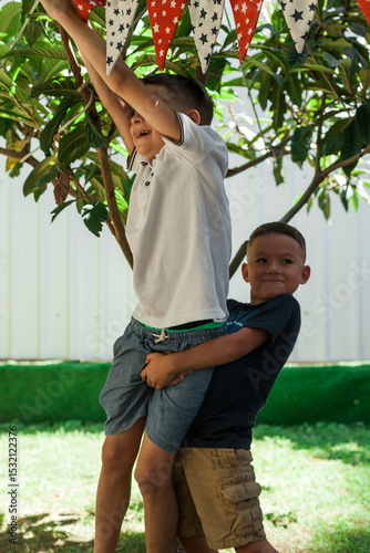 Group of kids playing actively in a shaded outdoor gazebo at summer camp. Fun and energetic movement games