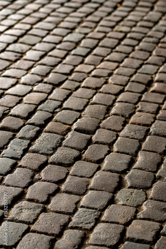 Detail of cobblestone pavement in historic district of Copenhagen, Denmark, clean texture background with copy space for heritage and urban planning themes