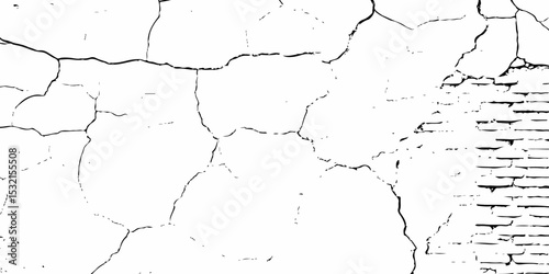 high contrast image of a cracked white plaster wall with exposed brick, creating textured and aged appearance in black and white.