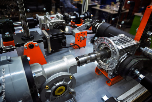Принти на полотні Close-up view of complex industrial machinery parts: gearboxes, motors, chains, shafts, and sprockets