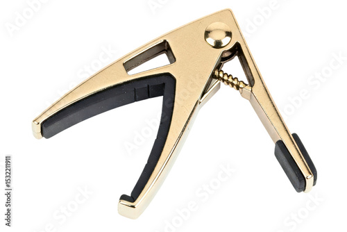 Golden guitar capo isolated on a transparent background