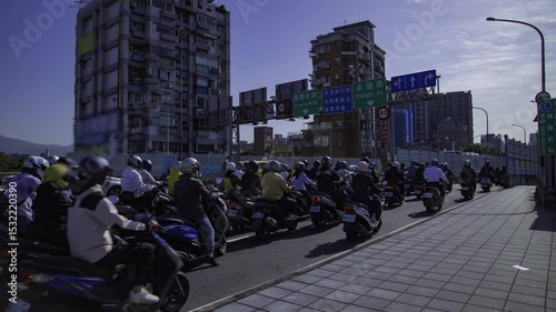 A timelapse of traffic jam at the bike street near Taipei bridge tilt