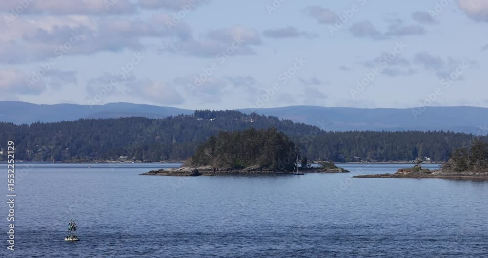 Scenic view of the ocean, islands, and mountains in British Columbia. Scenic view of the ocean, islands, and mountains in British Columbia.