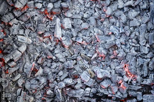 Burning coals background. Smoldering charcoal top view