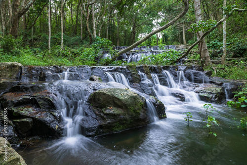 Samlan Waterfall, tier 3, multi-tier waterfall flowing through tropical forest in Thailand.