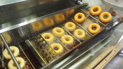 Donuts Frying on Production Line.
