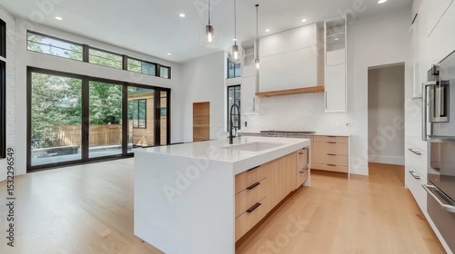 Sleek contemporary kitchen with integrated appliances, spacious island for storage and seating, minimalist design, smooth cabinetry, high-end finishes