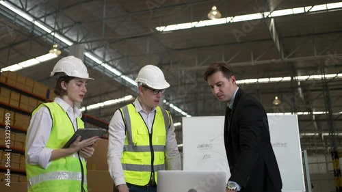Blue collar workers are working and meeting at warehouse. Industrial and factory.