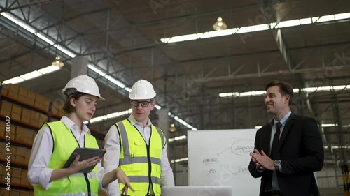 Blue collar workers are working and meeting at warehouse. Industrial and factory.