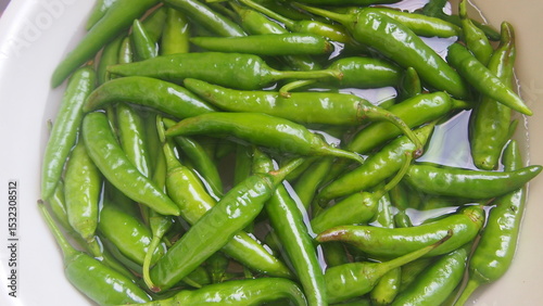 Fresh Green Chili Peppers in White Bowl - Korean Cooking Ingredients.