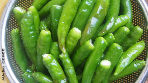 Fresh Green Chili Peppers in Strainer