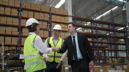 Blue collar workers are working and meeting at warehouse. Industrial and factory.