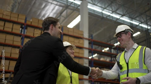 Blue collar workers are working and meeting at warehouse. Industrial and factory.