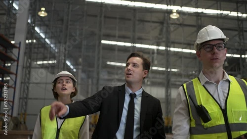 Blue collar workers are working and meeting at warehouse. Industrial and factory.