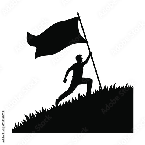 Silhouette of man planting a flag on a hill