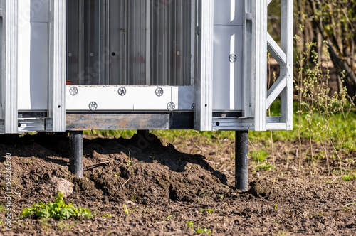 Pile foundation. Pile support of an apartment building. Modern frame house on stilts. The foundation for the house. photo