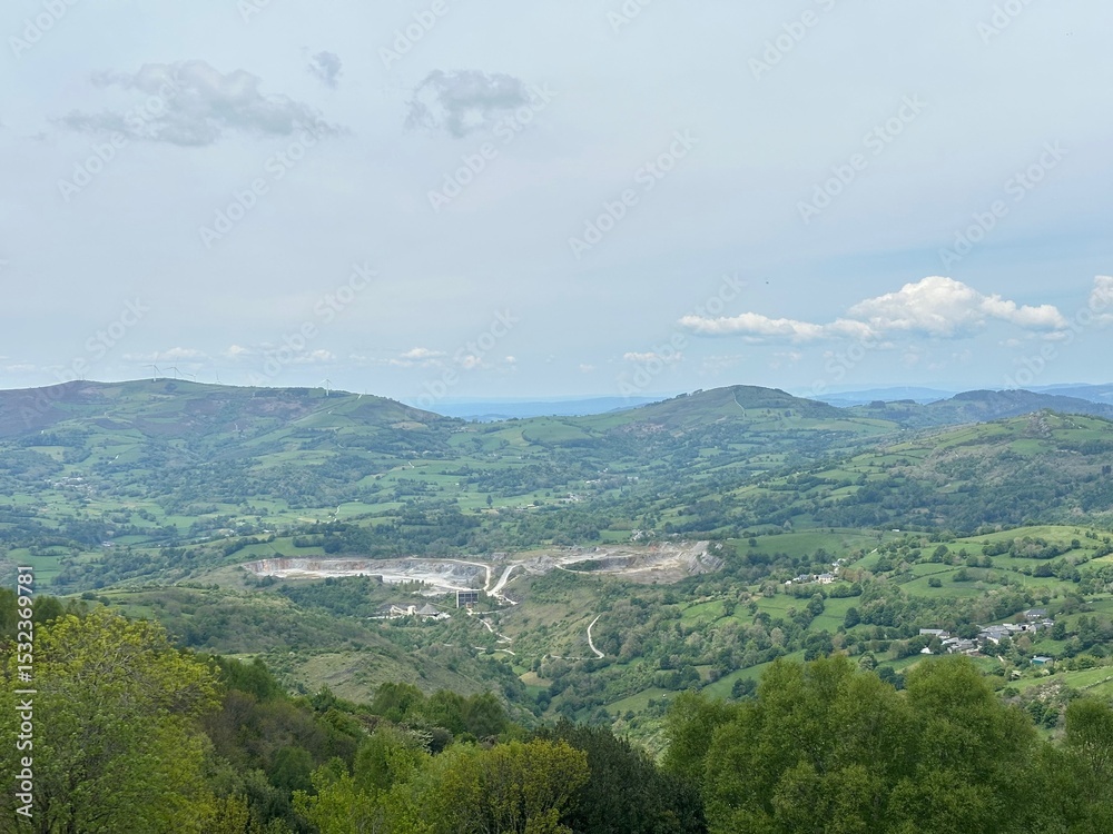 Fototapeta premium A landscape with trees and mountains