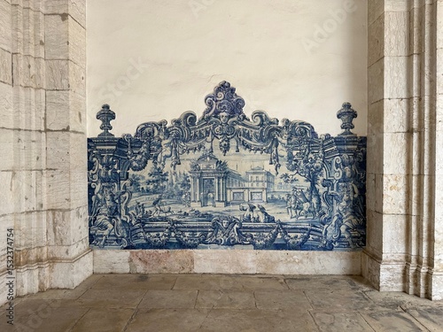 A blue wall with a painting