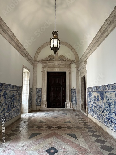 A hallway with a chandelier