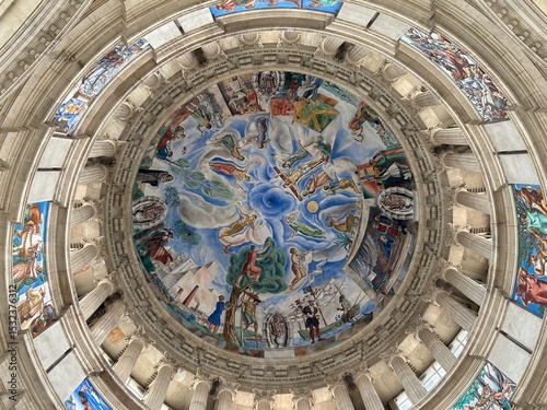 A large domed building with a mural