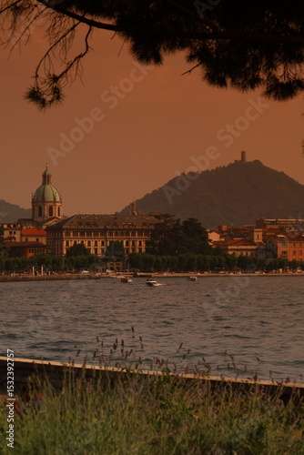 Lake Como at Sunset – Como Cathedral, Boats and Lakeside Promenade in Warm Orange Light