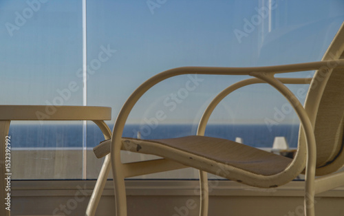 Outdoor promenade boat sun deck onboard modern luxury cruiseship cruise ship ocean liner with teak wood loungers and deck chairs for guests passengers with ocean view