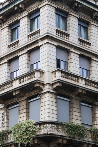 Corner of Italian Renaissance Building with Lush Vegetation – Historic Urban Architecture
