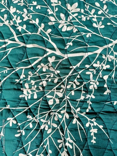 carpet floor covering motif in the shape of a tree and leaves in green and white photo