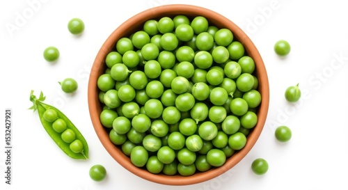 Fresh green peas in a terracotta bowl with loose peas