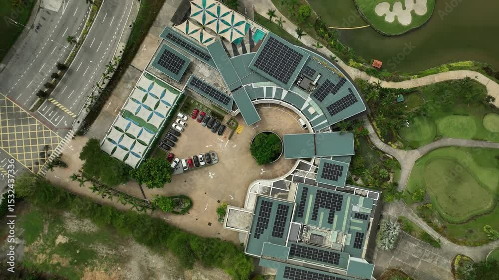 Urban eco-friendly building featuring solar panels and green spaces in a golf resort setting
